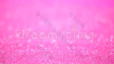 喜庆的粉红色背景。 抽象的闪亮灯光，闪亮的假日背景